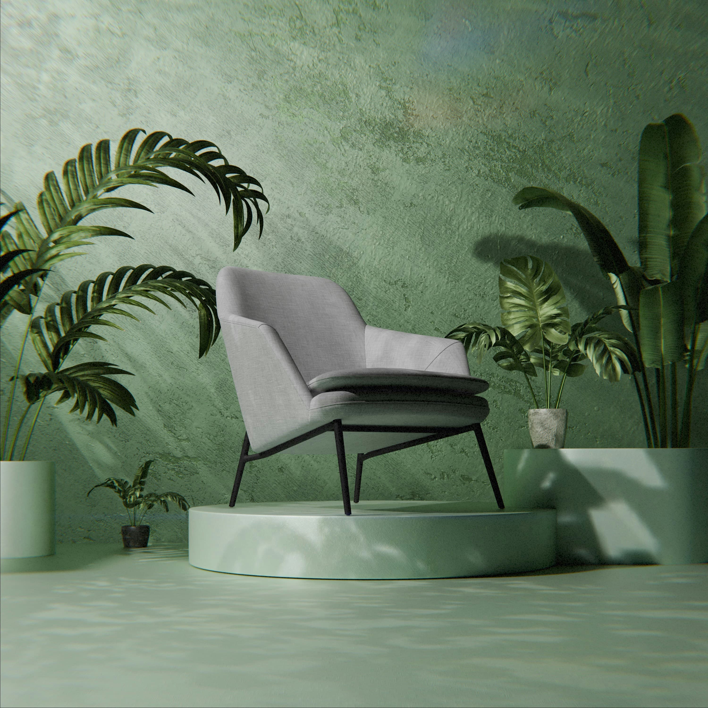 A lounge chair on a plinth in a green-washed studio set